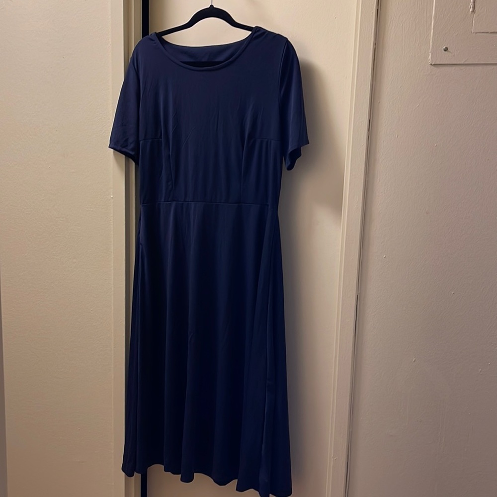 Acevog navy blue dress with opening in the back.